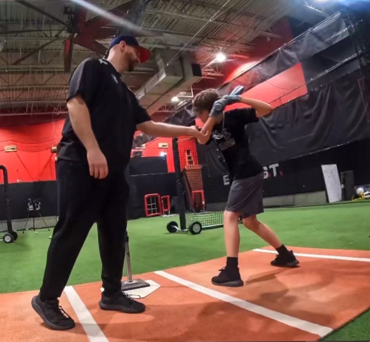 Sean in his batting stance in the cage