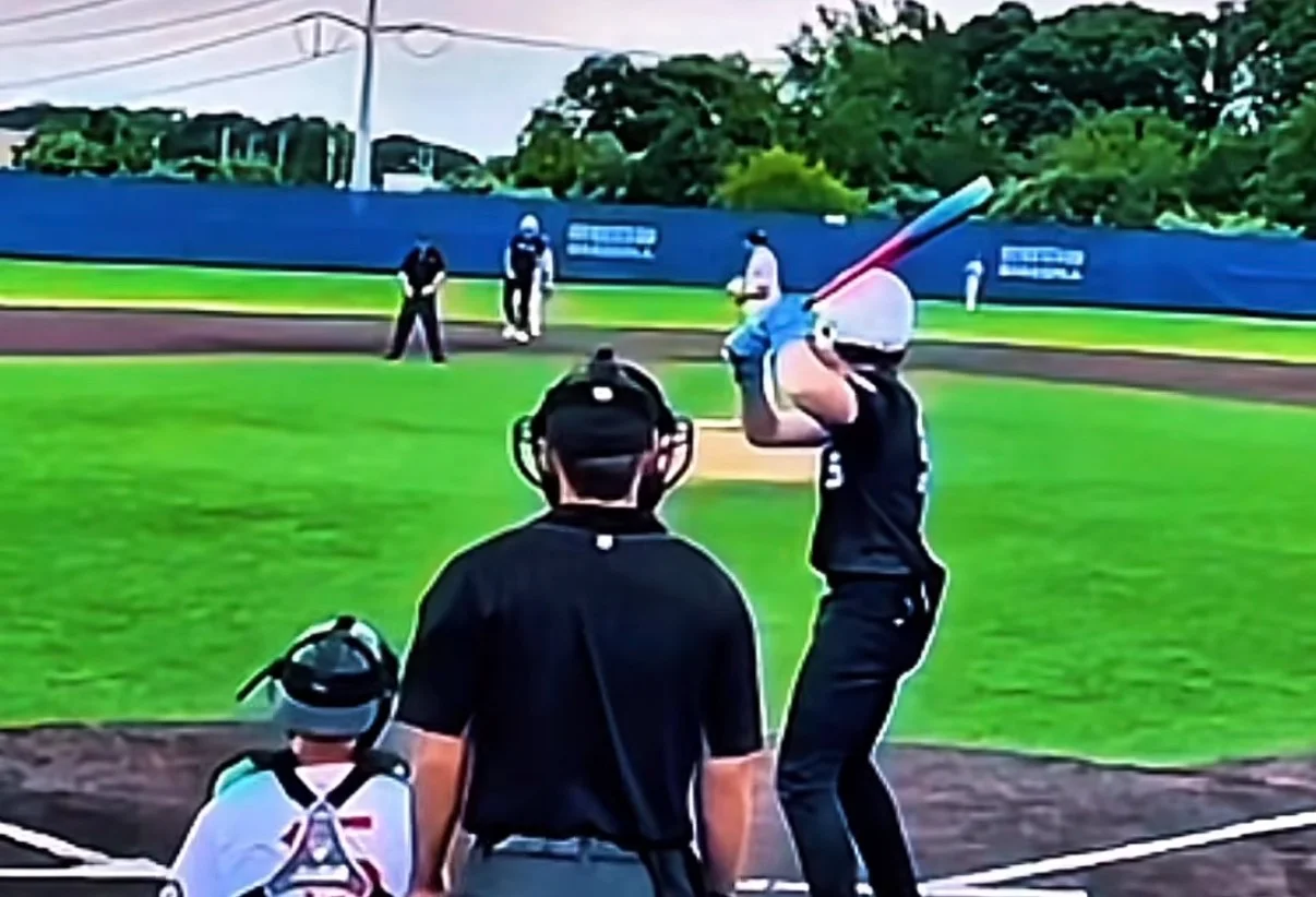 Gunnar Nelson swings during a game at-bat.