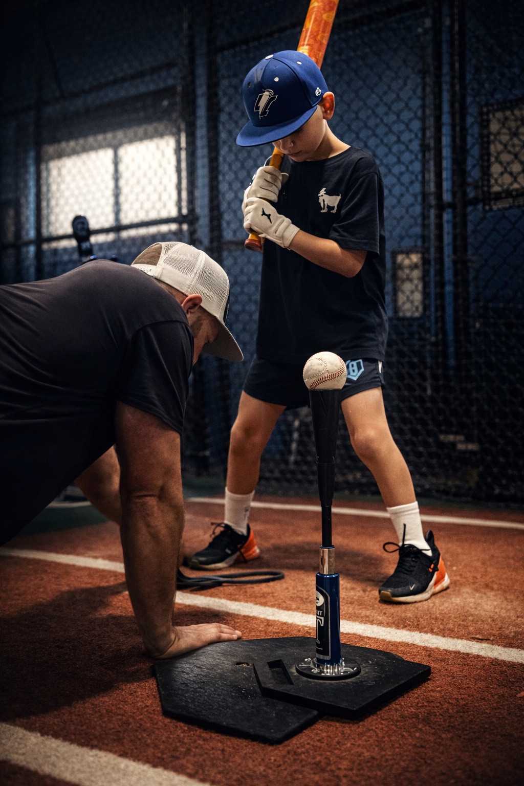 Hitter getting ready to hit baseball off tee